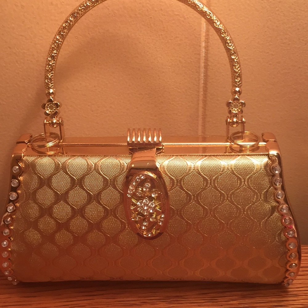Hard gold party clutch